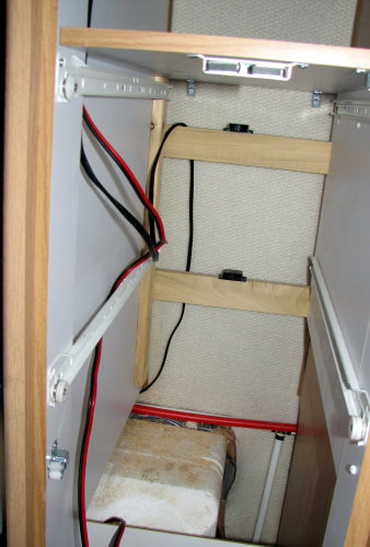 wires running from controller through closet and past water heater to storage area